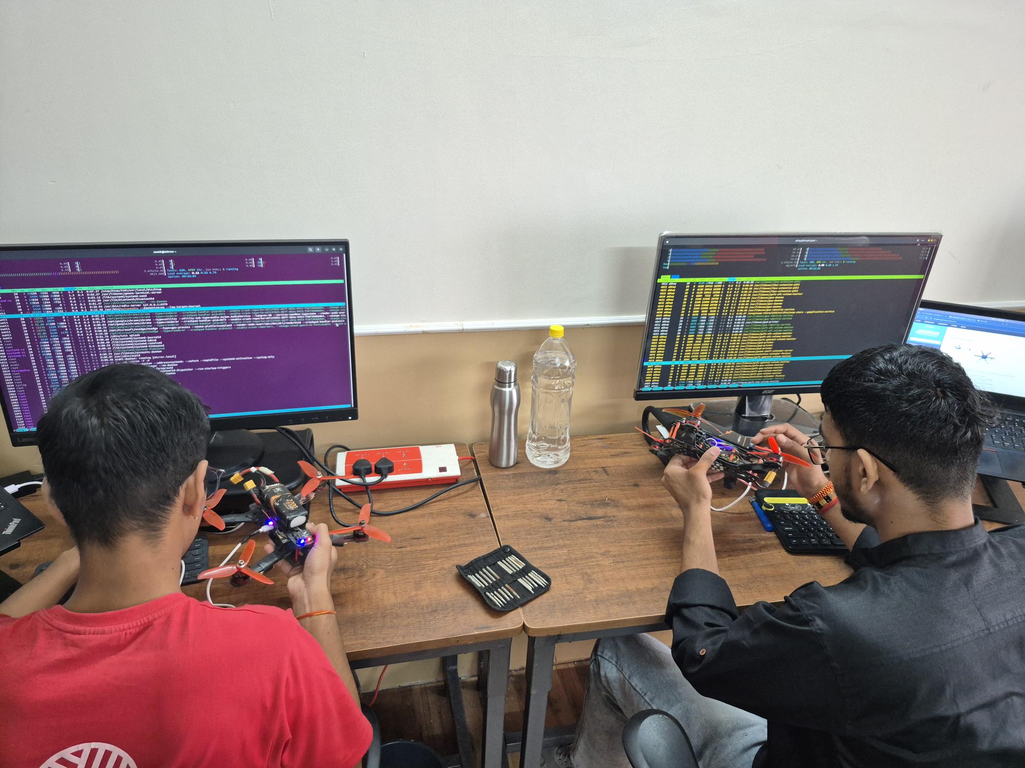 Students working with code and electronics during a practical session